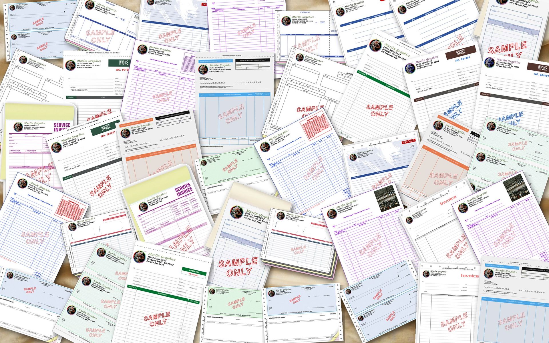 Twenty real Marlin Graphics business-form samples spread across a workbench